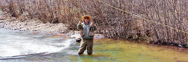 Fisherman in river